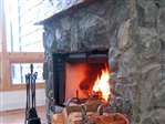 Stone fireplace for cool evenings & winter stays
